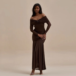 Detail of dark brown off-shoulder dress with elegant 3D rose accent and ruched fabric