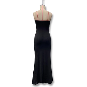 Detail of elegant black strapless maxi dress with draped fisheye silhouette for formal events