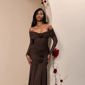 Detail of elegant off-shoulder brown dress with three decorative 3D fabric roses