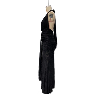 Detailed side view of black lace evening dress with halter neck and ruching texture