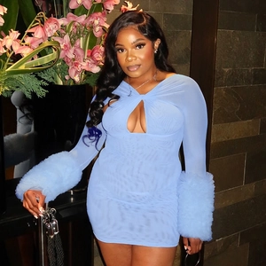 Detail view of light blue mesh dress featuring hollow-out front and faux fur sleeve cuffs