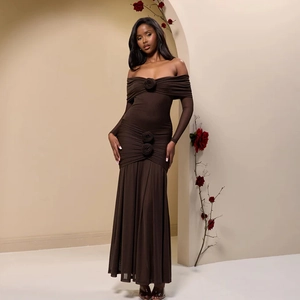 Detail of elegant dark brown off-shoulder dress featuring three 3D rose ornaments on waist