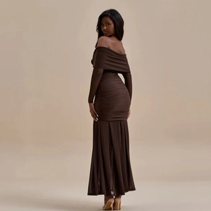 Detail of off-the-shoulder long sleeve dress with ruched design and fishtail hemline