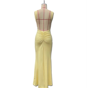 Detail view of backless cream maxi dress with gathered waist and mermaid silhouette