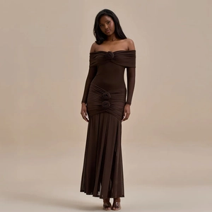 Detail of dark brown off-shoulder dress with 3D rose accents and ruched texture