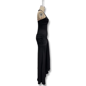 Detail view of the side ruching and drape texture on this black slim fit maxi dress