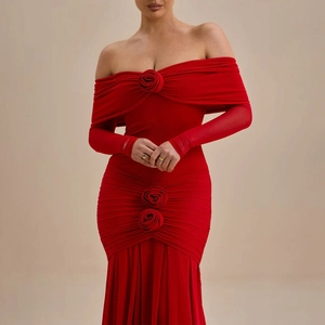 Detailed view of 3D fabric roses and ruched texture on elegant red off-shoulder evening gown