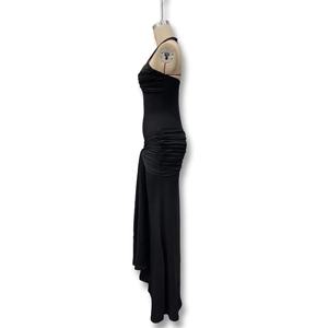 Close-up detail of the ruched texture and gathered side seams on this black bodycon dress