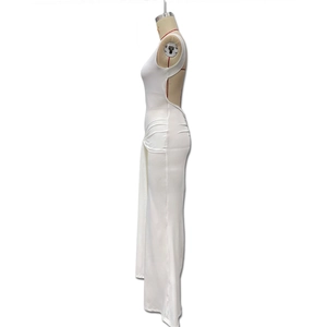 Detail of white backless bodycon dress featuring sleek ruched sides and long ribbons