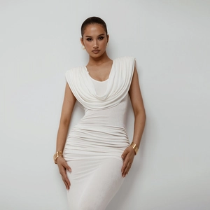 Detailed close-up of elegant cowl neck and ruched waist on a slim-fit white dress