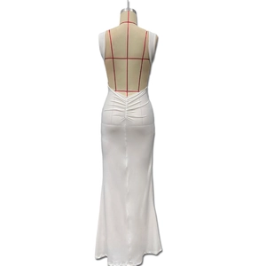 Detailed back view of white backless evening gown with waist pleats and floor length hem
