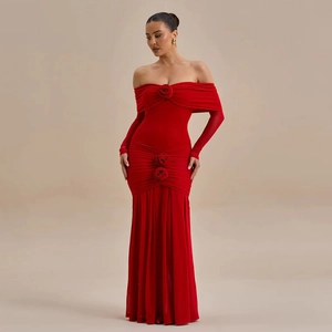 Detail of elegant red off-shoulder dress featuring handcrafted 3D rose embellishments