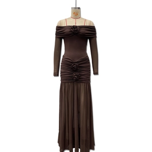 Detail of off-shoulder neckline with handcrafted rose flowers and ruched brown fabric