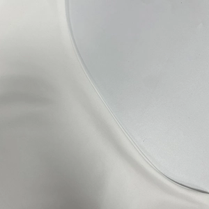 Macro shot of white silky satin fabric texture with smooth fine weave and natural luster