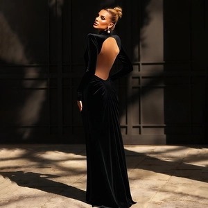 Detail of the elegant backless velvet dress featuring sophisticated ruched back detailing