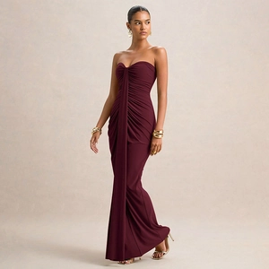 Detailed view of the pleated drapery and center ruching on this wine red formal dress