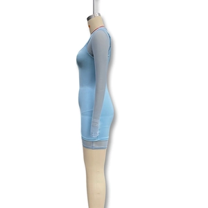 Detail of light blue bodycon mini dress with sheer mesh long sleeve layered top