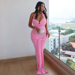 Detailed view of pink halter neck evening dress with metal ring and pleated draping