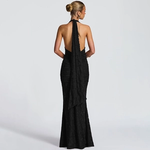 Elegant backless fishtail dress in black with halter neck ties and ruched detailing