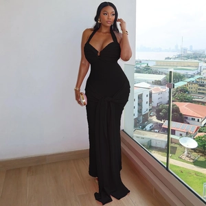 Elegant black halter neck bodycon dress with ruching and long ties for a sleek formal look