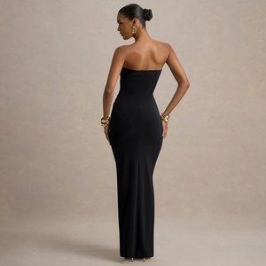 Back view of elegant black strapless bodycon maxi dress with ruched details for women