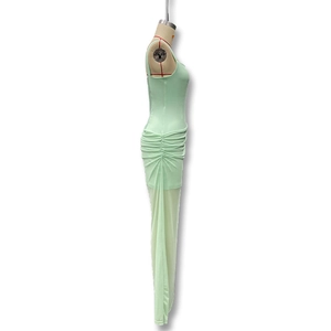 Detail view of mint green bodycon dress featuring elegant side ruching and mesh fabric