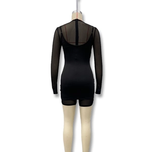 Detail view of black bodycon dress featuring sheer mesh sleeves and back panel design