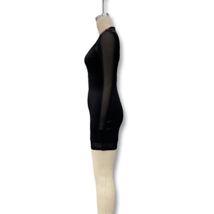 Detail view of the black mini dress with sheer mesh long sleeves on a mannequin