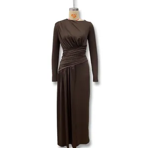Detail of the brown ruched long sleeve bodycon dress showing the textured fabric pleats