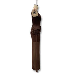 Detail view of ruched waist design and semi-sheer hem on a brown slim-fit midi dress