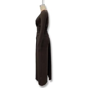Detail view of the side-ruched waist and pleats on this chocolate brown slim long sleeve dress