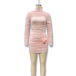 Detail of pink long sleeve mini dress with ruching and 3D fabric rose flower