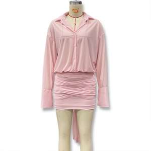 Detail of pink two-piece dress set with sheer button shirt and ruched bodycon skirt