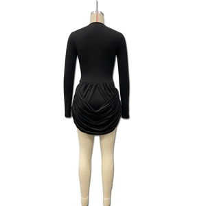 Detail of elegant black long sleeve bodycon dress showing back view and draped ruching