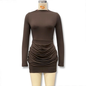 Close-up of horizontal ruched detail on a coffee brown bodycon dress hemline