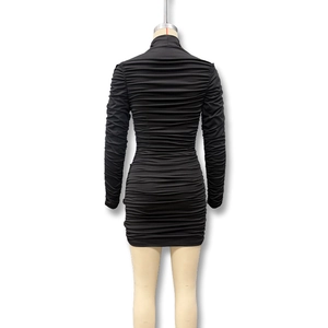 Detail of black long sleeve bodycon dress with ruched texture and high collar