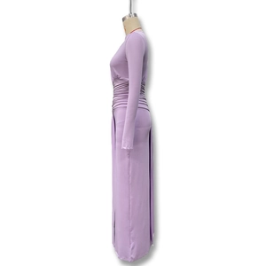 Detailed side view of purple long sleeve dress featuring cinched waist pleated texture