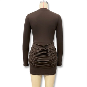 Macro shot of the detailed ruched texture on back of the dark brown bodycon mini dress