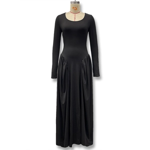 Detail of the elegant gathering pleats and draping fabric on this black long sleeve dress