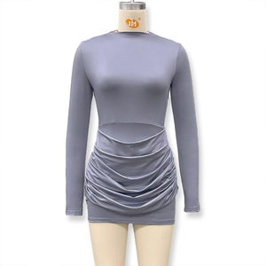 Detailed view of long sleeve bodycon dress with side cutout and ruched mini skirt detail