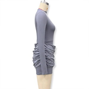 Detail view of grey long sleeve bodycon dress with side ruching on a mannequin