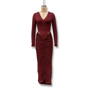 Detailed close-up of wine red long sleeve dress featuring sheer mesh waist cutouts and ruching