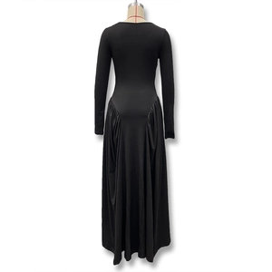 Detailed back view showing ruched waist and flowing skirt of this long sleeve black maxi dress