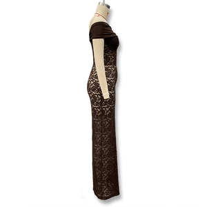 Detail view of the brown lace fabric texture and off-the-shoulder slit design on this dress