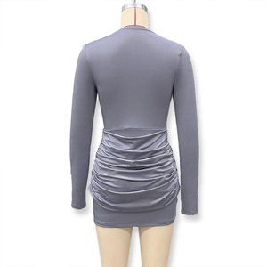 Detailed view of the ruched design and bodycon fit on this dark grey mini dress