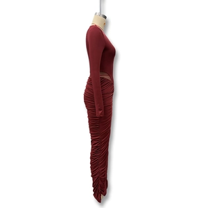 Detailed side view of dark wine red dress with side waist cut-out and ruched texture