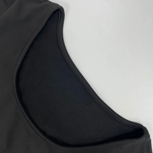Close-up of double-needle stitching on French elegant long sleeve black dress fabric