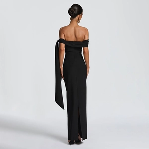 Detailed back view of a slim-fit off-shoulder black dress with chic ribbon and back slit
