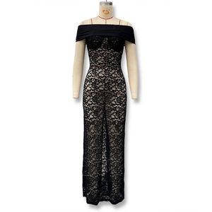 Detail of elegant black lace dress featuring off-the-shoulder design and slim fit silhouette