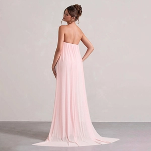 Back view of light pink strapless evening dress with long elegant trailing mesh train